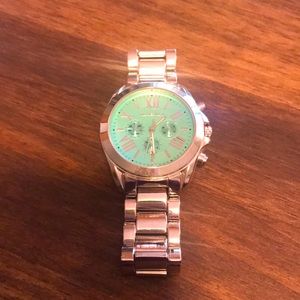 Women’s Michael Kors watch. Sliver with beautiful light teal face.